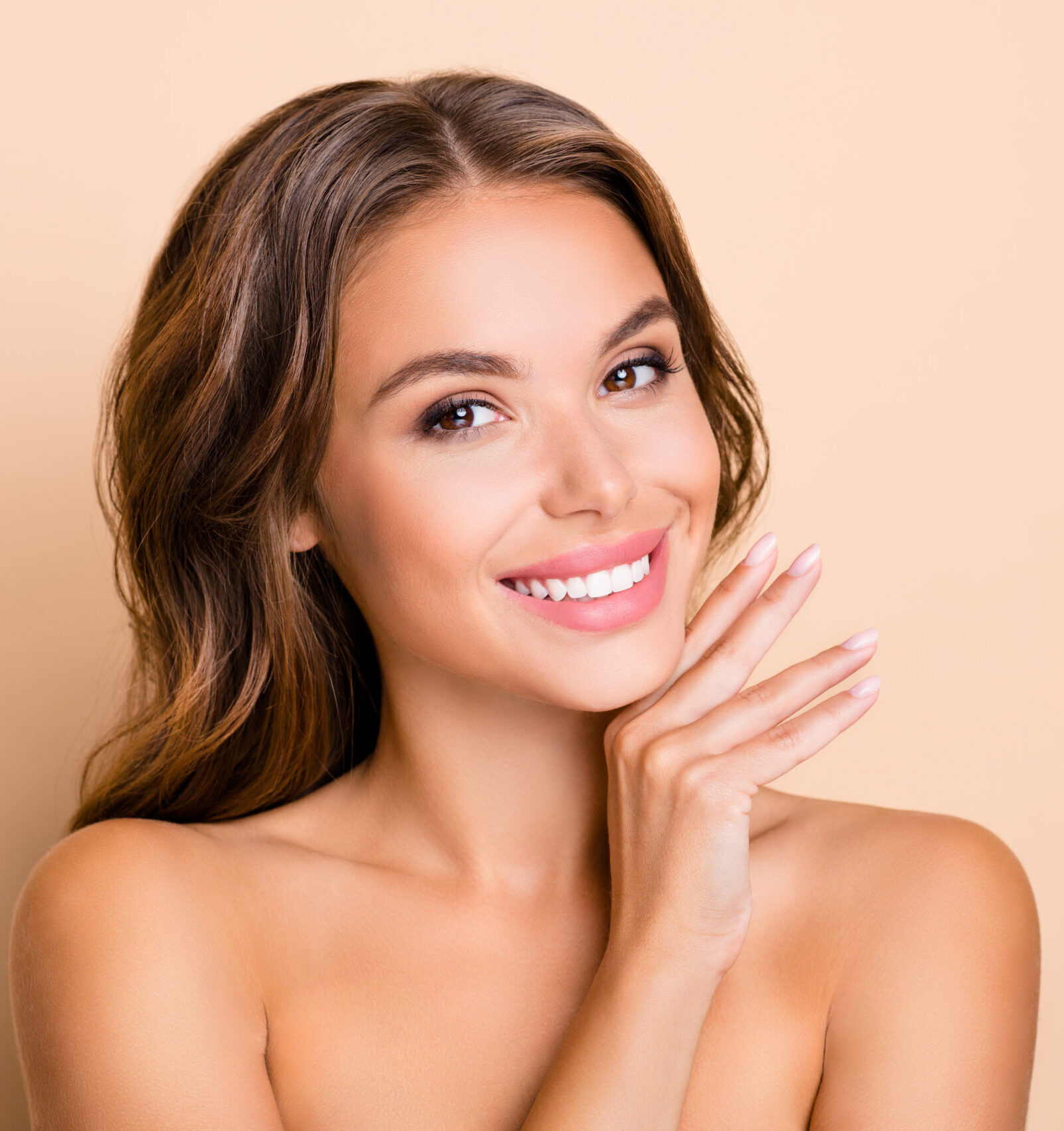 woman with smooth youthful face feeling the benefits of the Active Peel System from iS Clinical